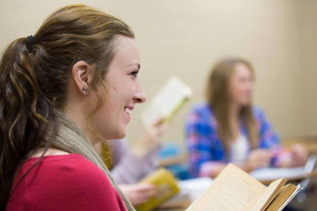 Students in class smiling