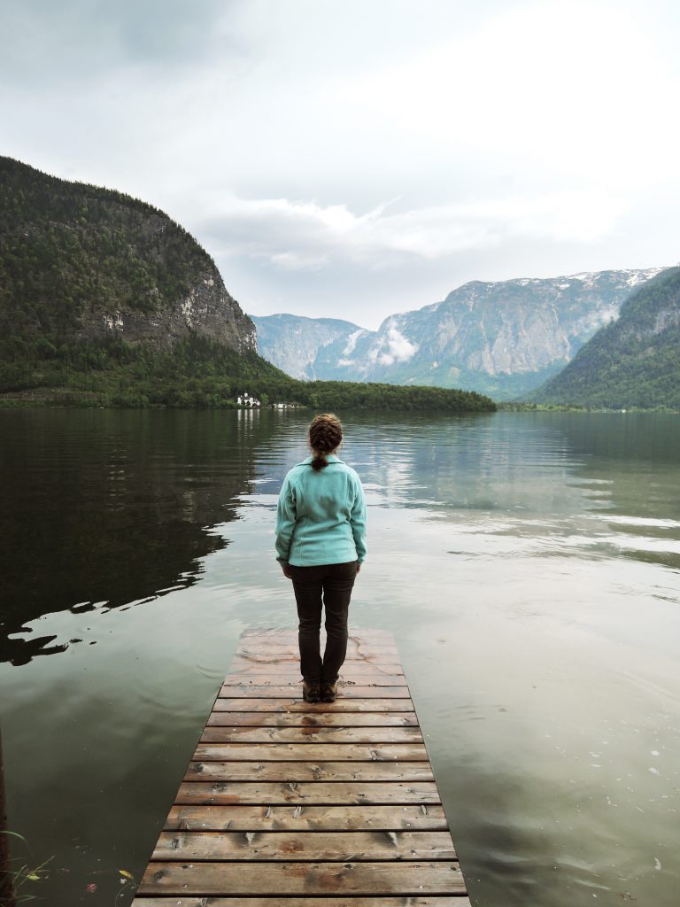 Go encounter photo of a student on a dock in front of mountains