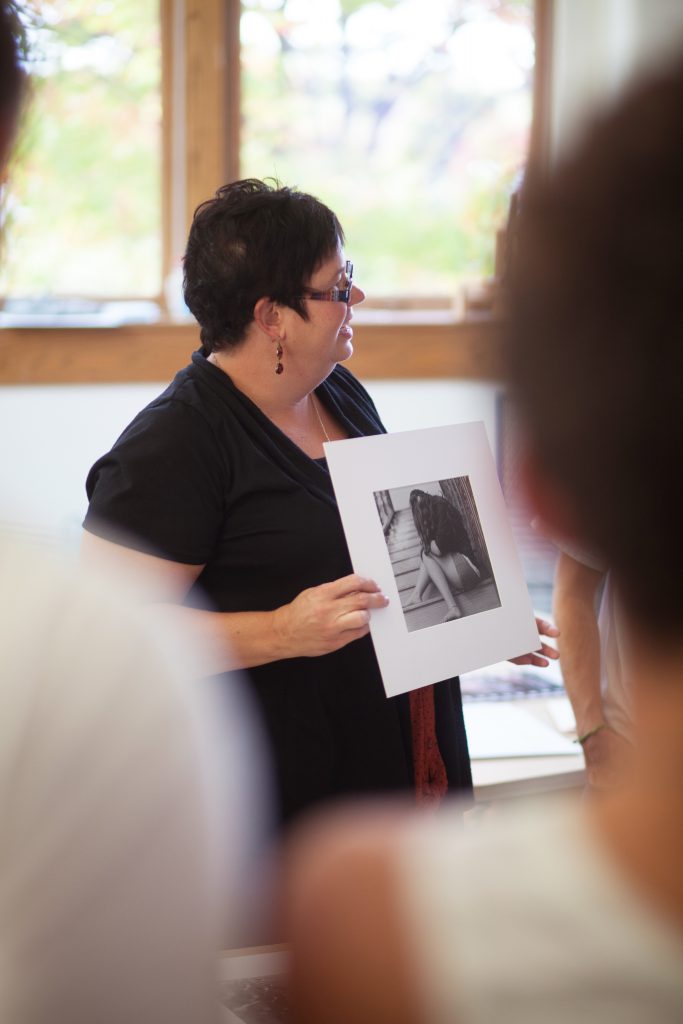 Professor Croy showing students photography
