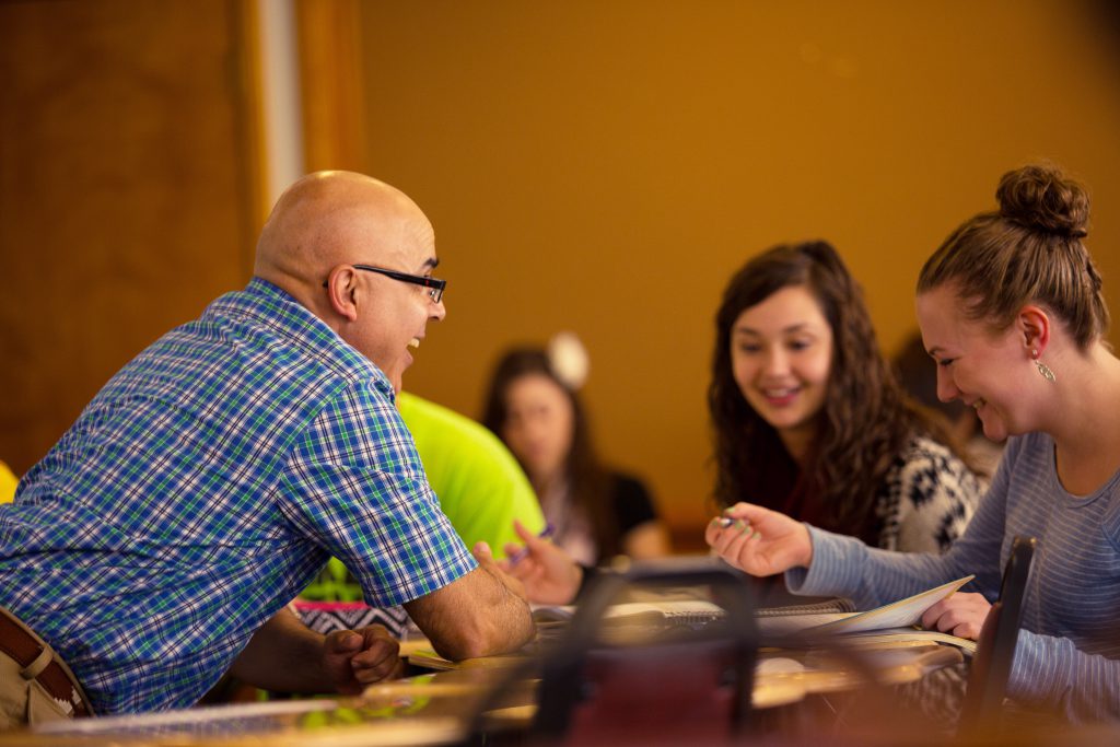 Spanish Degree Professor with students in a class