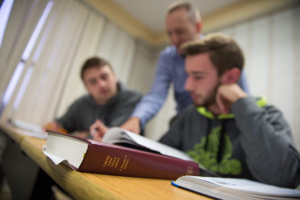 Greek book with students and professor