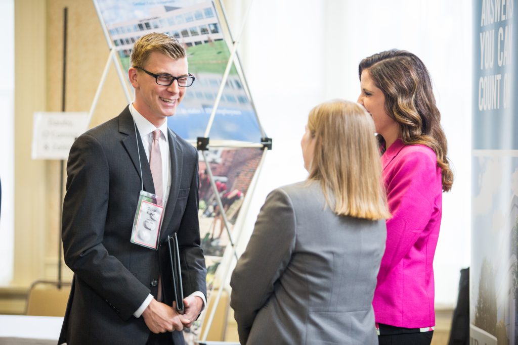 Business students with booths