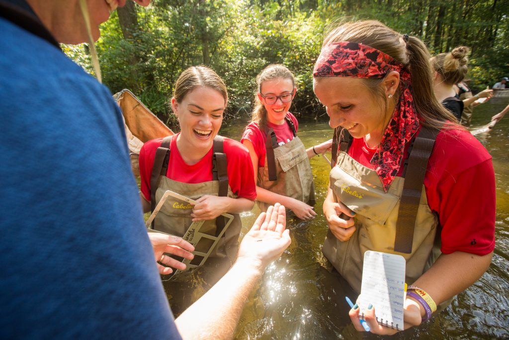 Life Science Education Major students with Dr. Bosch in stream collecting data
