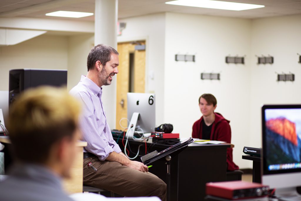 Students in class with professor teaching