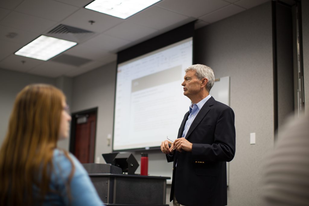 Professor teaching in front of a class