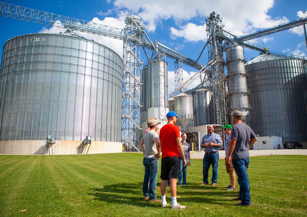 Students outside silos in agribusiness class