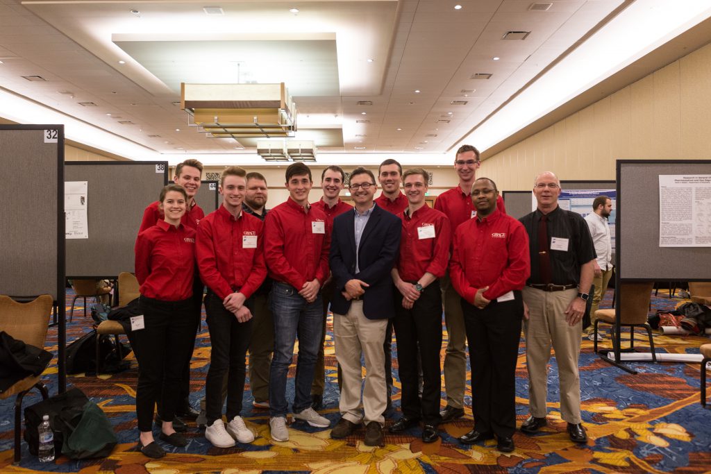 Chemistry professor, Dr. Chad Snyder, with students at the IAS conference