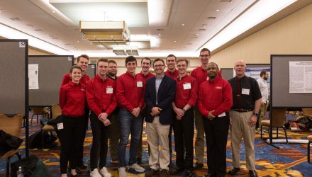 Chemistry professor, Dr. Chad Snyder, with students at the IAS conference