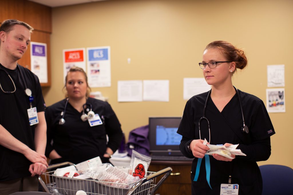 Nursing students with medical items