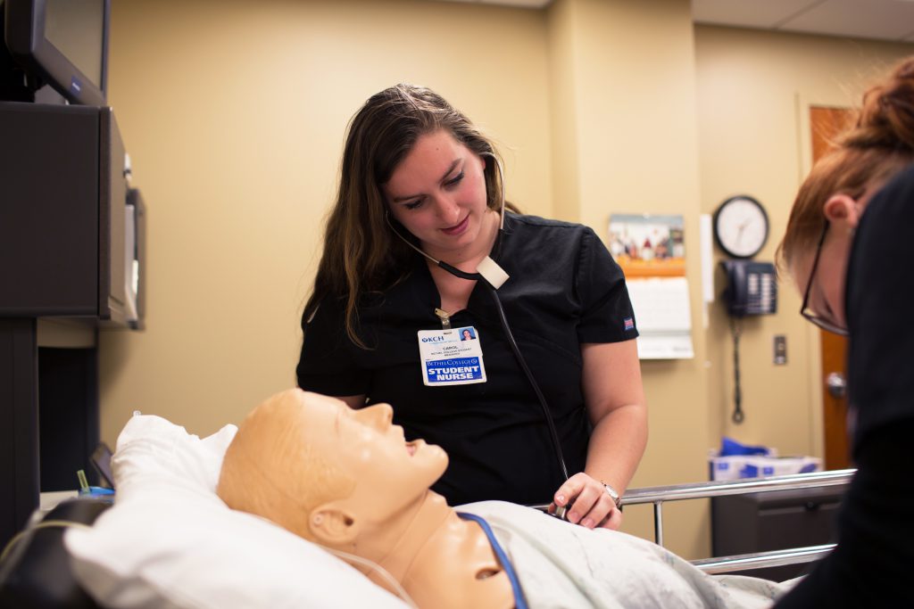 Nursing students with test dummy