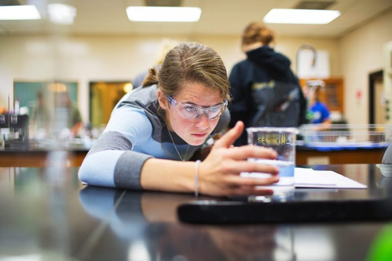 Student working in science lab bachelor in chemistry