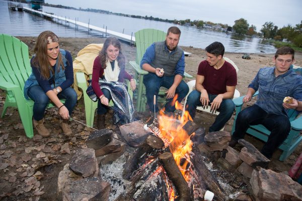 Students at campfire at the lake