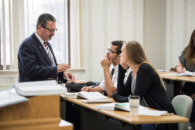 Professor answering student questions