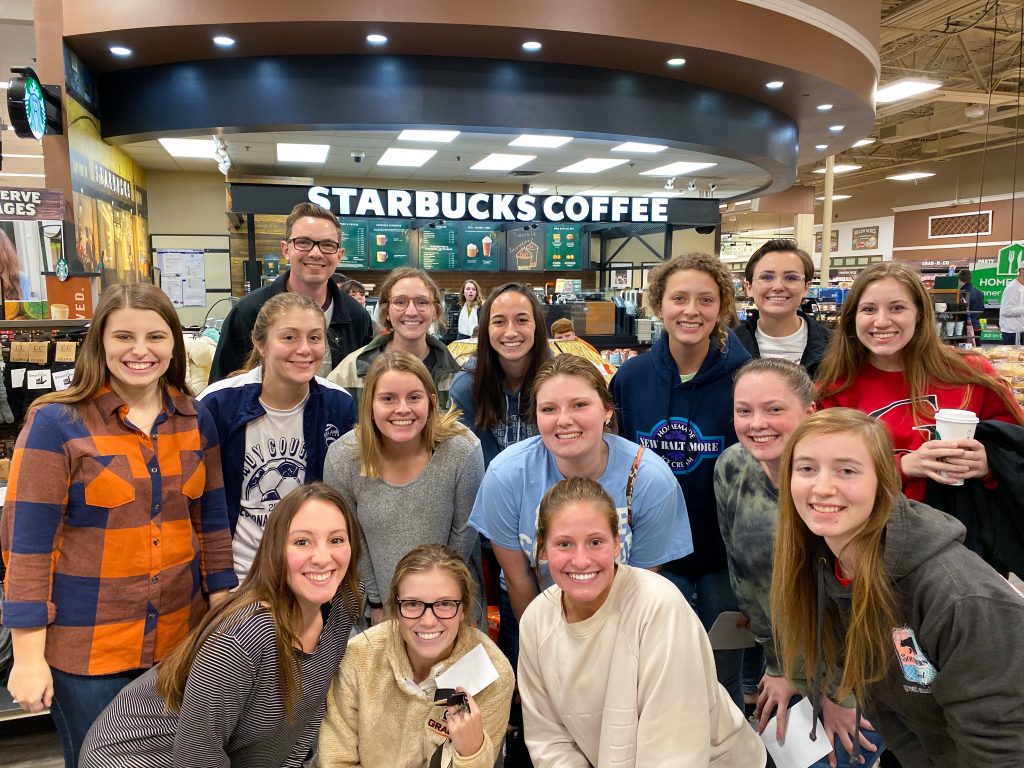 A group of Grace College students gathers at Starbucks, enjoying fellowship and discussing ministry opportunities in everyday settings.