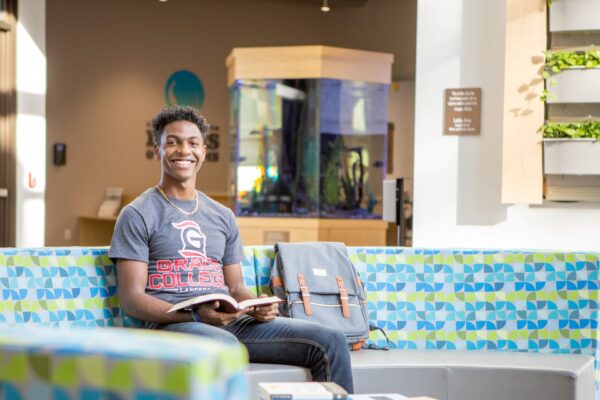Student reads the Bible in the Miller Science Complex. Bible College vs. Christian Liberal Arts College: Grace College explores what is a Bible College and a Christian Liberal Arts College.