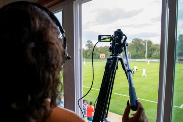 Looking for Sport Management Colleges? Grace College offers a Sport Management Degree with a Media arts and Communication Concentration. Girl Video recording soccer game.